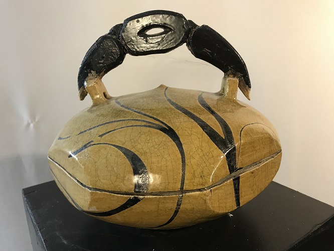 'Kisbah container,' Raku fired with an African influenced design. 10 inch diameter x 11 inch height, by Joel Moses