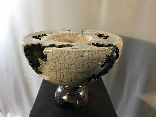 'Double walled bowl 'fracture' series,' Wheel thrown and raku fired with white crackle and heavy copper interior.  Hand cut design.  13 inches wd. x 10inches ht., by Joel Moses